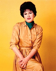 Patsy in a gold dress